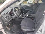 the interior of a small car with a steering wheel and dashboard