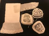 a black and white photo of a collection of doily items