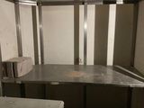 an image of a jail cell with a sink and a counter