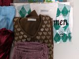 a pile of clothing that is sitting on a table