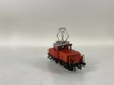 a toy train on a white surface with a white background