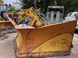 a yellow bulldozer that is sitting in the dirt