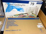 two boxes of quilting kits on a table