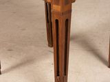 a wooden table with a drawer on top of it