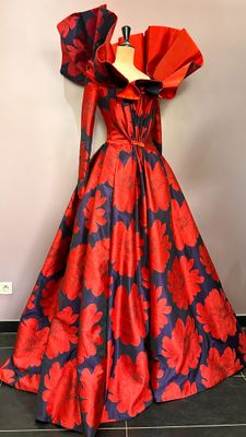 a red and blue dress on a mannequin mannequin mannequin mannequin mannequin mannequin mannequin mannequin mann
