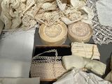 many different types of laces and doily on the table