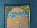 a close up of a magic the gathering card on a table
