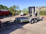an image of a flatbed trailer parked in a lot