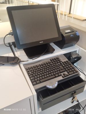 a computer sitting on top of a desk with a keyboard and mouse