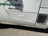 a white van with a green sticker on the side of it