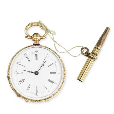 an old pocket watch with a pen on a white background