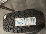 a tire with a sticker on it sitting on the ground