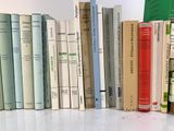 a lot of books that are sitting on a table