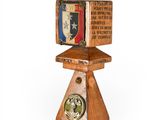 a small wooden box with a clock on top of it