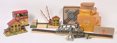 a lot of toy train tracks and buildings on the table