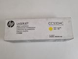 a box of yellow hp laser toner cartridges on a white surface