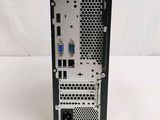 a close up of a small computer tower on a white surface