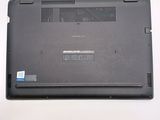 a laptop that is sitting on a white table