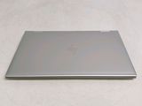 a laptop that is sitting on a white surface