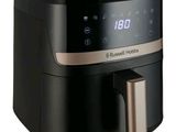 a close up of an air fryer on a white background