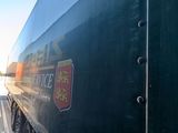 a truck that is parked next to a building