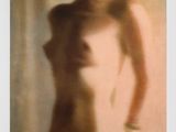 painting of a nude woman standing in front of a window