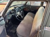 an old car that is sitting in a lot
