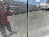 a reflection of a person in the side mirror of a car