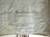 a piece of paper with writing on it sitting on top of a table