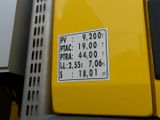 a close up of a sign on a yellow truck