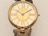 a gold watch with a blue second hand