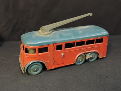 a toy bus that is sitting on a black surface