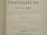 an open book with a black and white image of the title of a novel