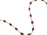 un collier en or et en garnétine composé de perles ovales