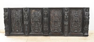 a large wooden cabinet that has carvings on it