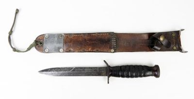 two knives are laying next to each other on a white surface