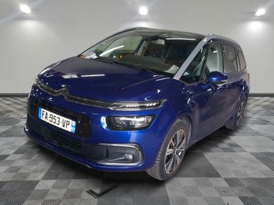 the blue citrole is parked on a checkered floor