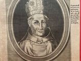 a black and white photo of a portrait of a man wearing a crown