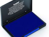 the blue ink pad is in a black case on a white surface