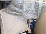 a cardboard box filled with toys and other items