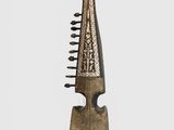 an old wooden instrument with a long neck and a wooden handle