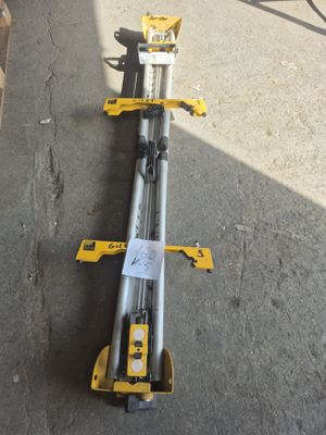a close up of a couple of tools laying on top of a cement floor