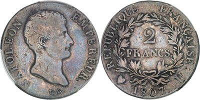 a close up of a coin with a crown on top of it