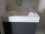 a bathroom with a sink and a mirror in it