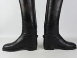 pair of black leather riding boots with buckles on each side