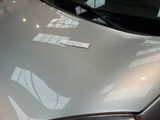 a close up of a car with a sticker on it ' s hood