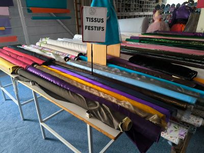 a lot of different colors of fabric on a table