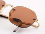 sunglasses on a white surface with a pair of brown lenses