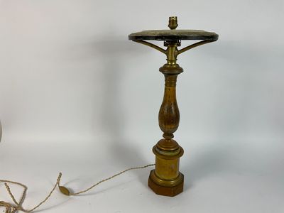a lamp that is sitting on a table next to a glass