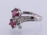 an image of a close up of a ring with a ruby stone